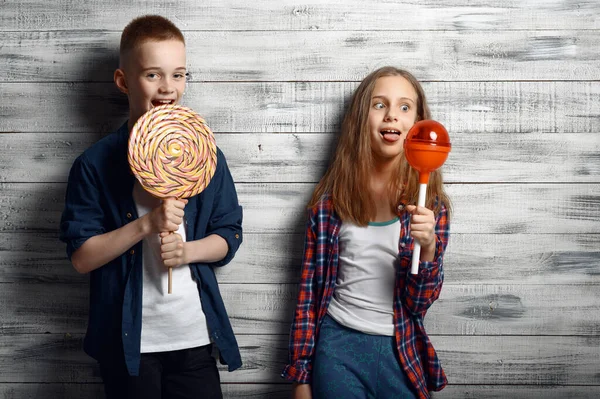 Little Boy Girl Holds Big Lollipops Studio Children Sweets Kids — Stock Photo, Image