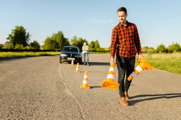 Male Instructor Puts Traffic Cones Road Driving School Man Teaching — Stock Photo, Image