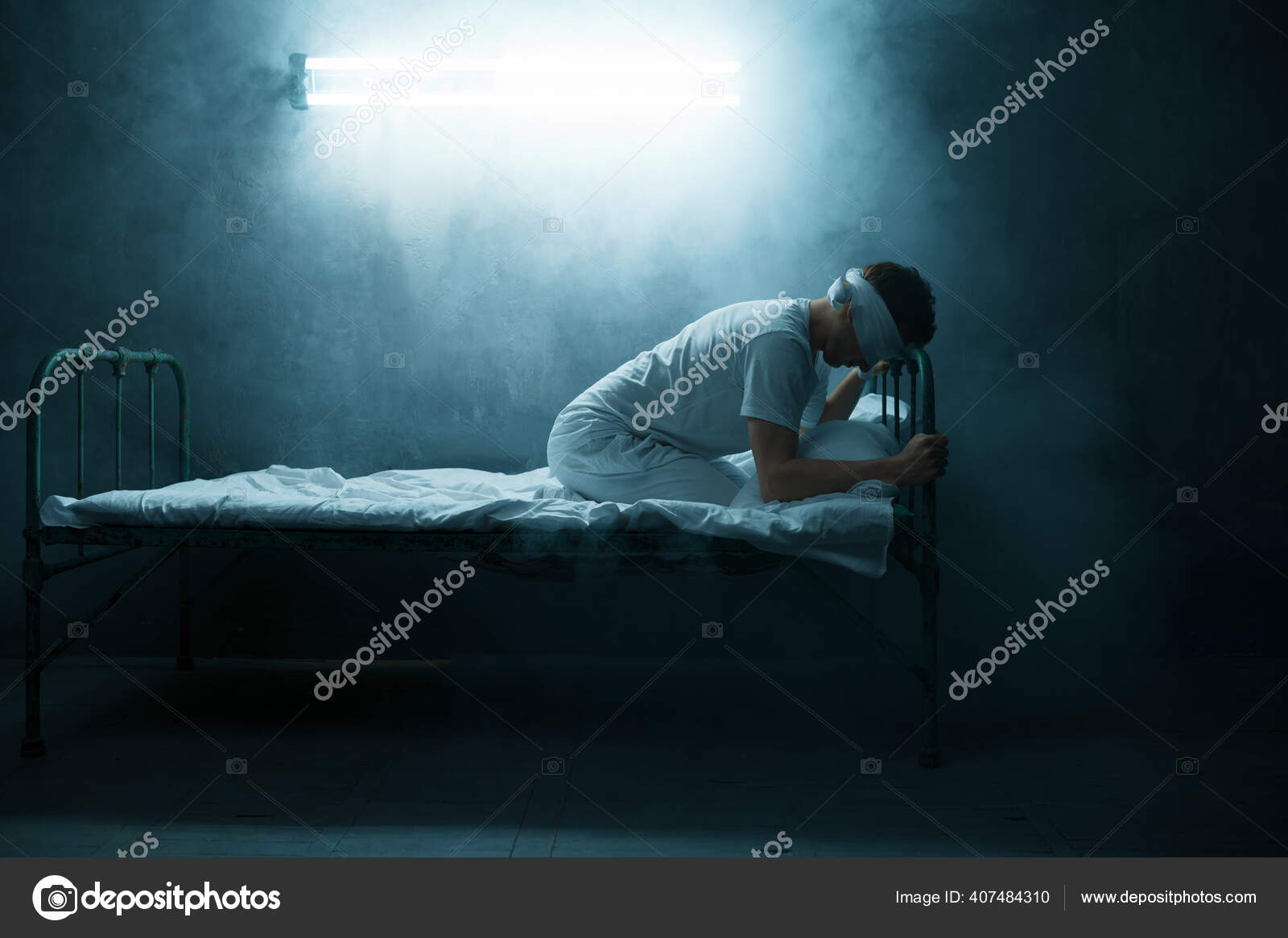 Mysterious image of a blindfolded man in a dark room stock photo