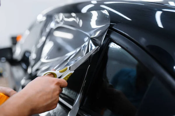 Male Worker Holds Sheet Film Car Tinting Installation Tuning Service — Stock Photo, Image