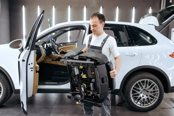 Worker Holds Removed Car Seat Dry Cleaning Detailing Vehicle Washing — Stock Photo, Image