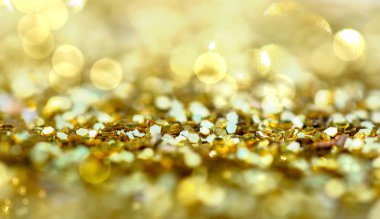 Altın glitter oluşturduğu soyut tatil backgrounf bulanıklık ışıklar 