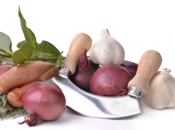 Heap of onions, shallots and garlic with a manual chopper on whi — Stock Photo, Image