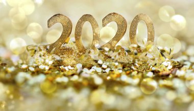 bulanıklık ışıklarında altın parıltının oluşturduğu soyut tatil arka planındaki altın figürler 