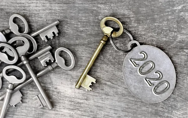 Old  key and 2020 written on ring — Stock Photo, Image