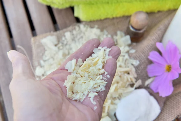 Pieces of soap in a hand of a  woman to homemade laundry — Stock Photo, Image