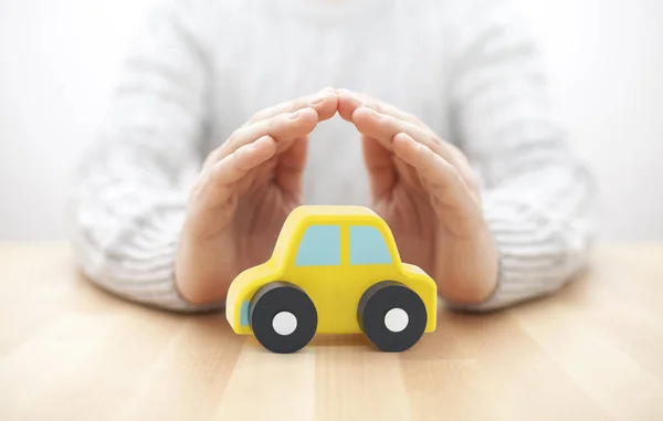 Car Insurance Concept Small Toy Car Covered Hands — Stock Photo, Image