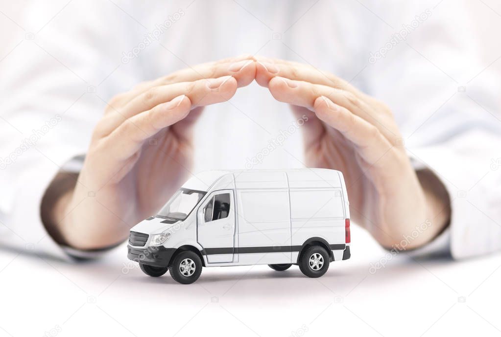 Transport white van car protected by hands 