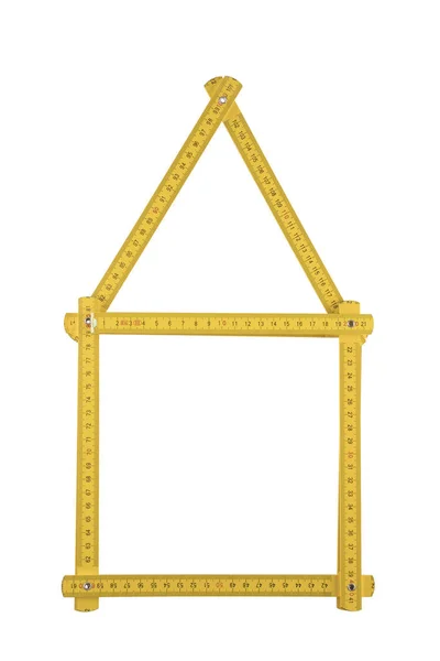 白い背景で隔離の家に折り畳まれている黄色メートル定規 — ストック写真