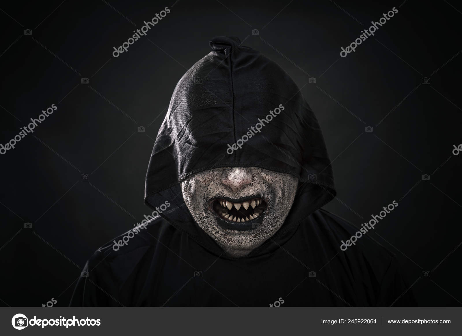Scary Figure Hooded Cloak Showing His Sharp Pointy Teeth Stock Photo by  ©sqback 245922064