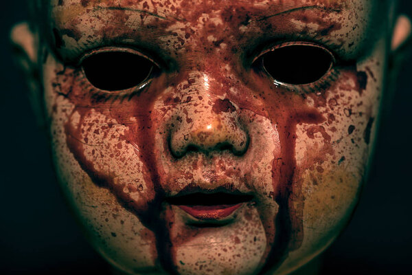 Creepy bloody doll in the dark 