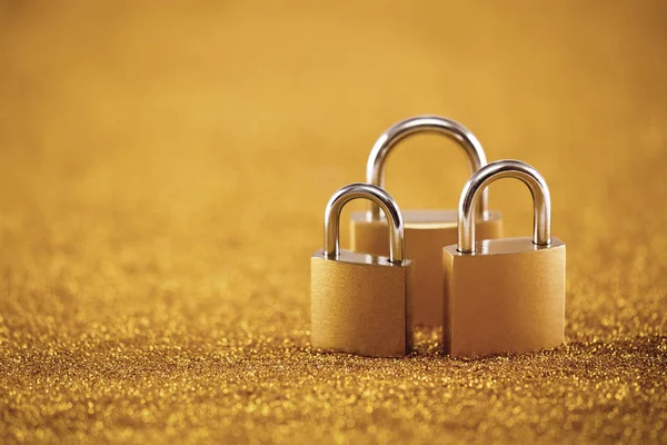 Security Concept Three Metal Padlocks Golden Background — Stock Photo, Image