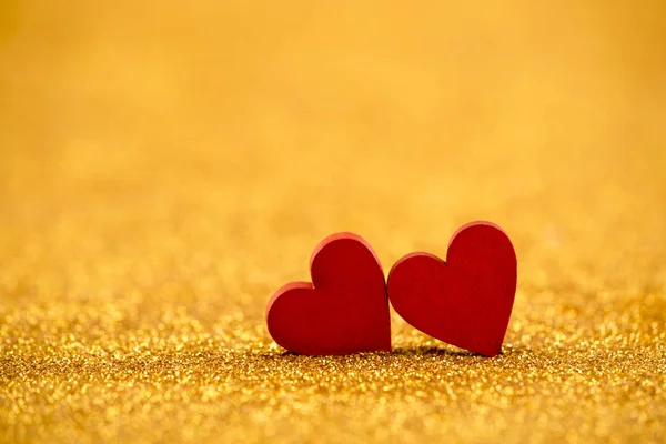 Two Red Hearts Golden Glitter Background Love Concept — Stock Photo, Image