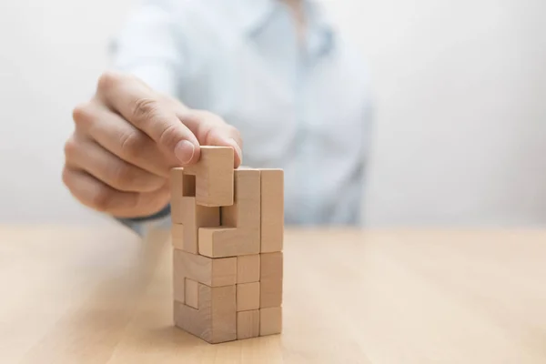 Man Hand Adding Last Missing Wooden Block Place Business Success — Stock Photo, Image