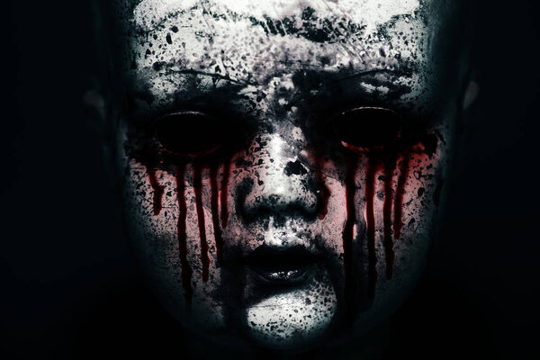 Creepy bloody doll in the dark 