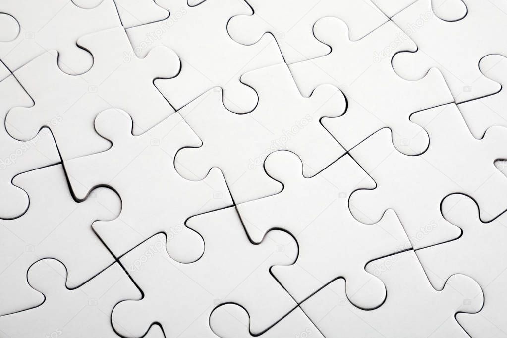 Top view of white jigsaw puzzle 