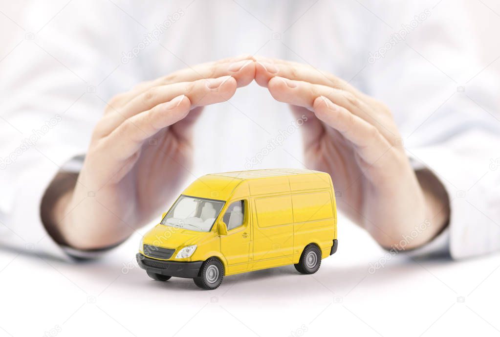 Transport yellow van car protected by hands 