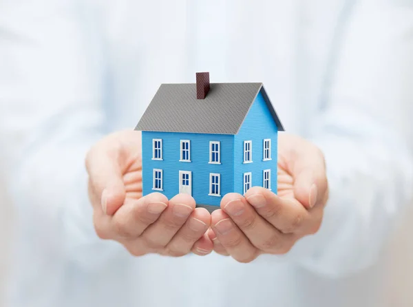Small Blue Toy House Hands — Stock Photo, Image