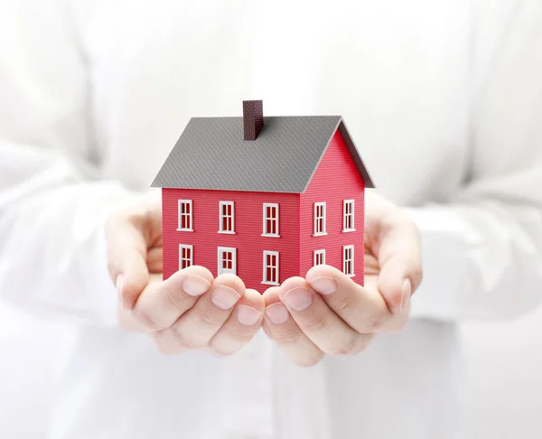 Small Red Toy House Hands — Stock Photo, Image