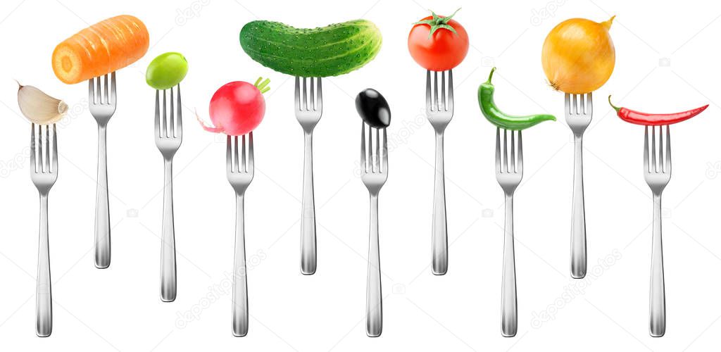 Isolated vegetables collection. Tomato, cucumber, garlic, carrot, olives, radish, peppers and onion on forks isolated on white background with clipping path