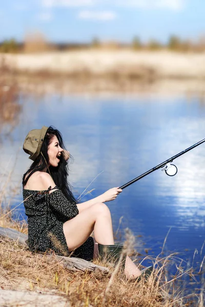 Woman fishes on the lake