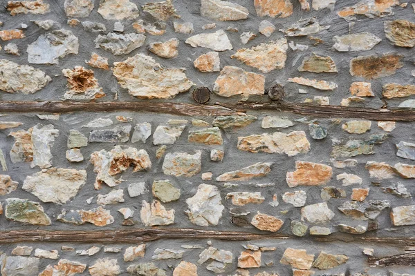 Stone house wall of old house in Olympic riviera, Greece