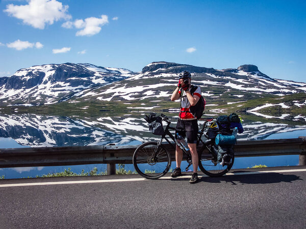 Cyclists traveling in the mountains of Norway