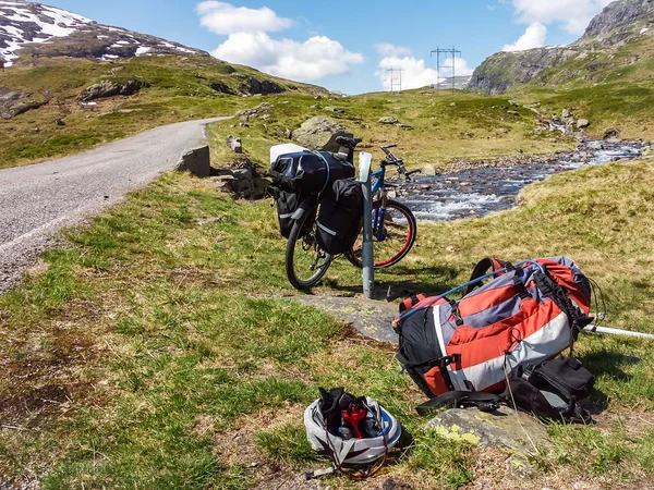 Cyclists traveling in the mountains of Norway.