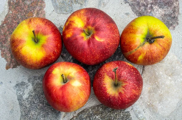 Five red apples with a top view