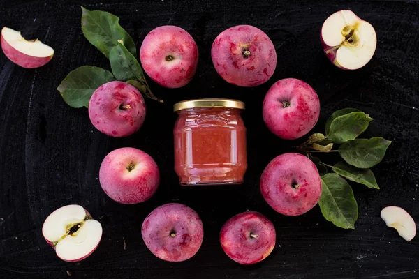 Red apple jam ingredient top view on black — Stock Photo, Image