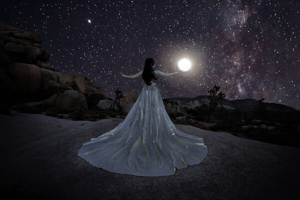 Girl Light Painted in the Desert Under the Night Sky