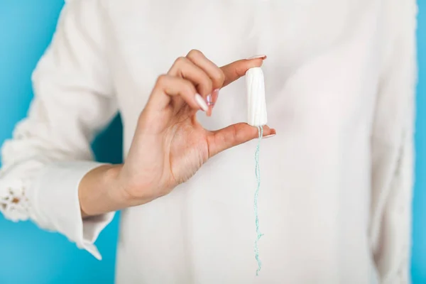 Woman holding a tampon — Stock Photo, Image