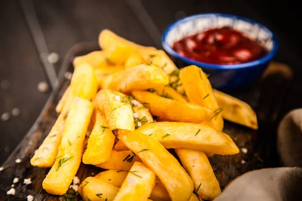 French fries on wooden table — Stock Photo, Image