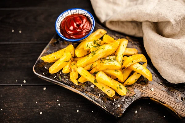 French fries on wooden table — Stock Photo, Image