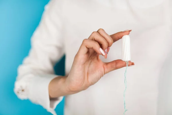 Woman holding a tampon — Stock Photo, Image