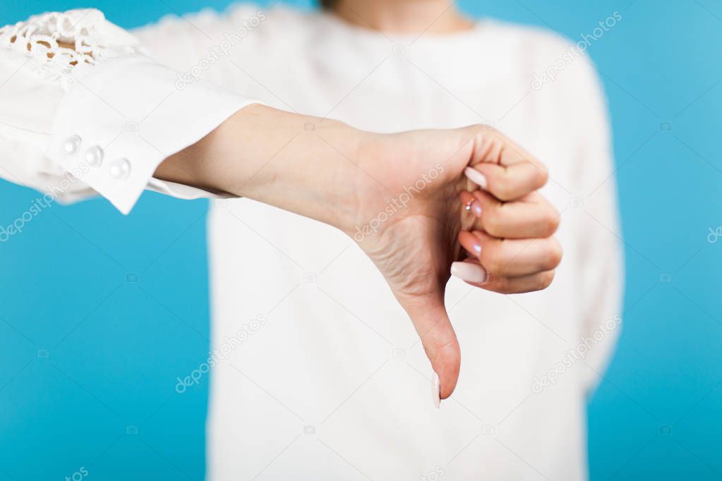 Female hand on blue background