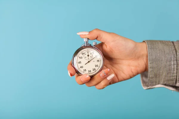 Female hand holding a stopwatch — Stock Photo, Image