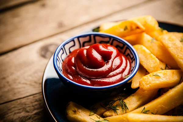 French fries on wooden table — Stock Photo, Image