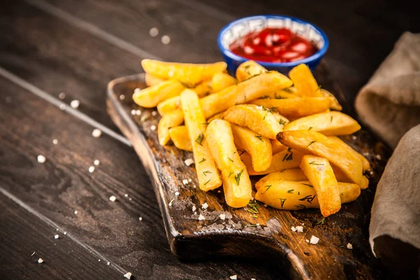 French fries on wooden table — Stock Photo, Image