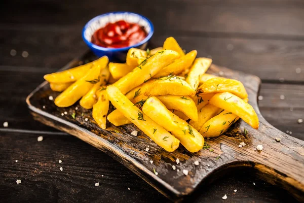 French fries on wooden table — Stock Photo, Image