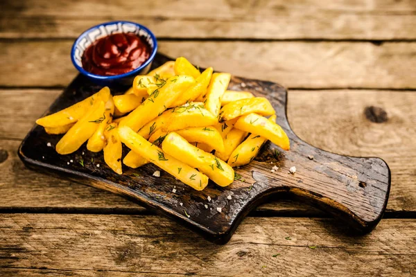 French fries on wooden table — Stock Photo, Image