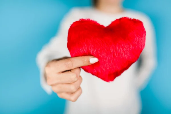 Female hands holding a red heart — Stock Photo, Image