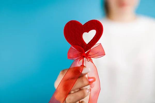 Female hands holding a red heart — Stock Photo, Image