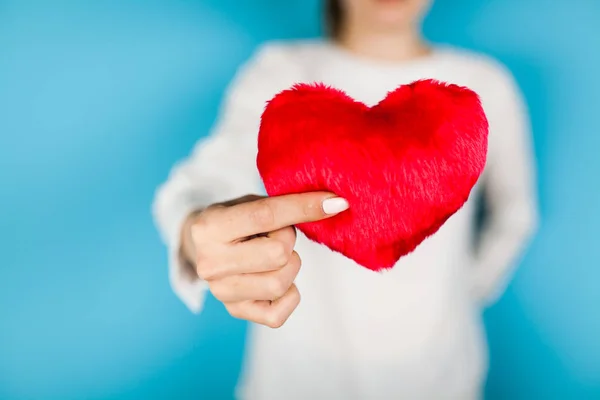 Female hands holding a red heart — Stock Photo, Image