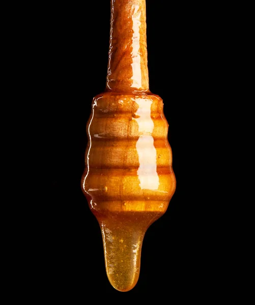 Cazo de miel sobre fondo negro —  Fotos de Stock