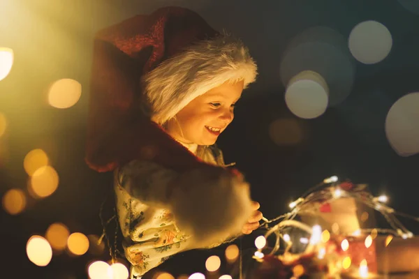 Baby girl opening Christmas presents — Stock Photo, Image