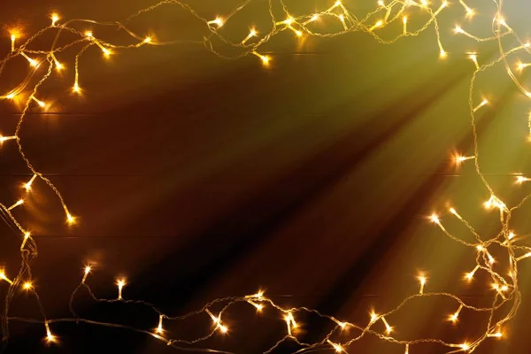 Christmas lights on wooded background — Stock Photo, Image