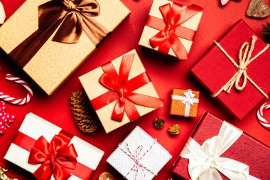 Gift boxes on red background clipart