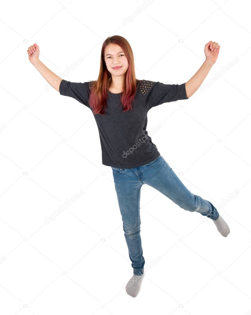 young girl jumping with arms extended isolated on white