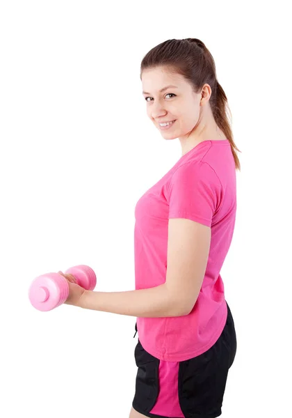 Женщина упражняется с гантелями — стоковое фото